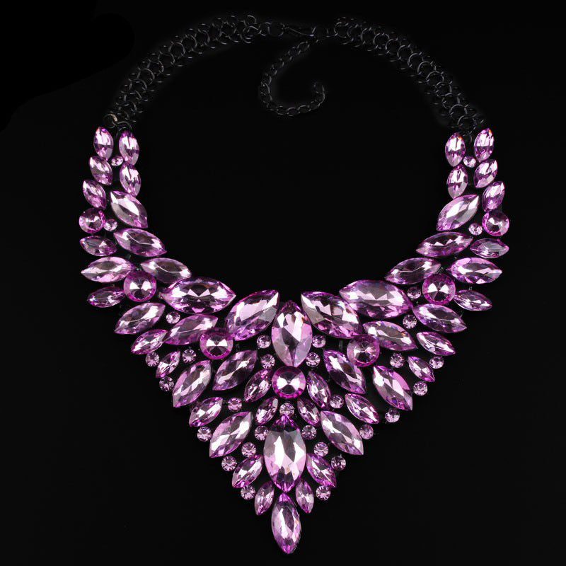 A luxury alloy rhinestone necklace with a chain of pendants featuring large purple rhinestones, displayed against a black background.