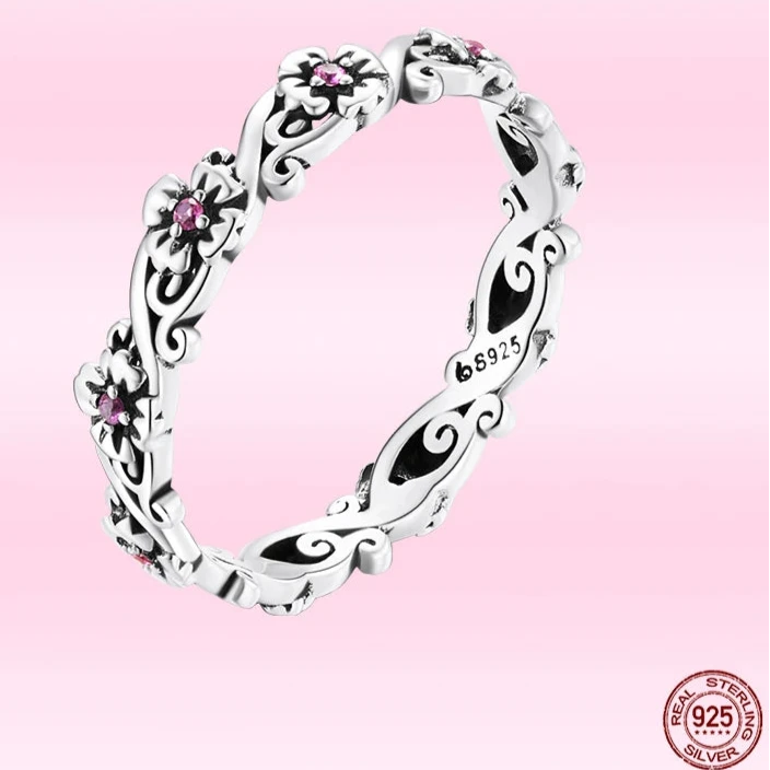 A sterling silver ring featuring a classic vintage pattern with zircon embellishments.
