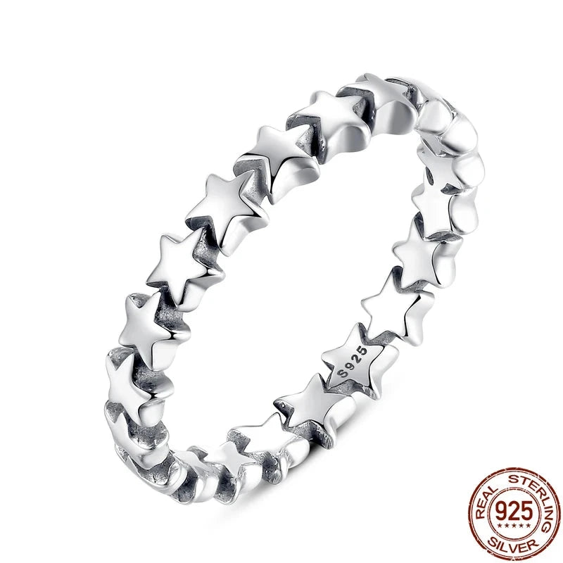 A silver 925 sterling silver ring with a star-shaped pattern.