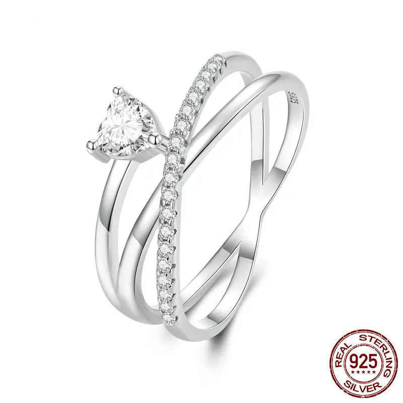 A 925 sterling silver multi-layer ring with a central zircon stone surrounded by smaller clear stones set in a geometric pattern.
