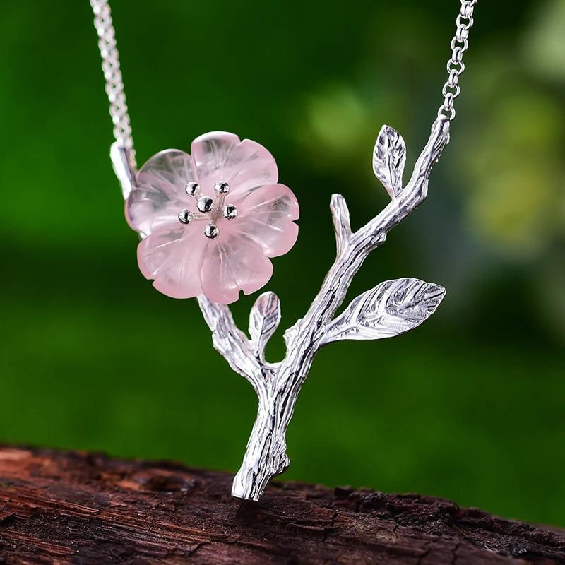 Women's Crystal Flower Pendant Necklace 295 with an elegant silver branch design, featuring a delicate translucent flower inspired by nature jewelry.