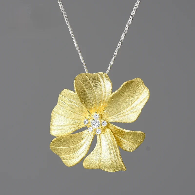 Luxury floral jewelry pendant necklace for women with sparkling zircon crystals and 18K gold plated flower design on a 925 sterling silver chain