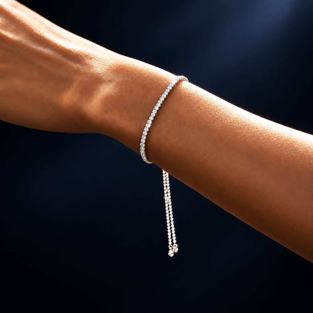 925 sterling silver CZ jewelry bracelet featuring a row of sparkling cubic zirconia stones and an adjustable slider chain in a classic tennis bracelet design.