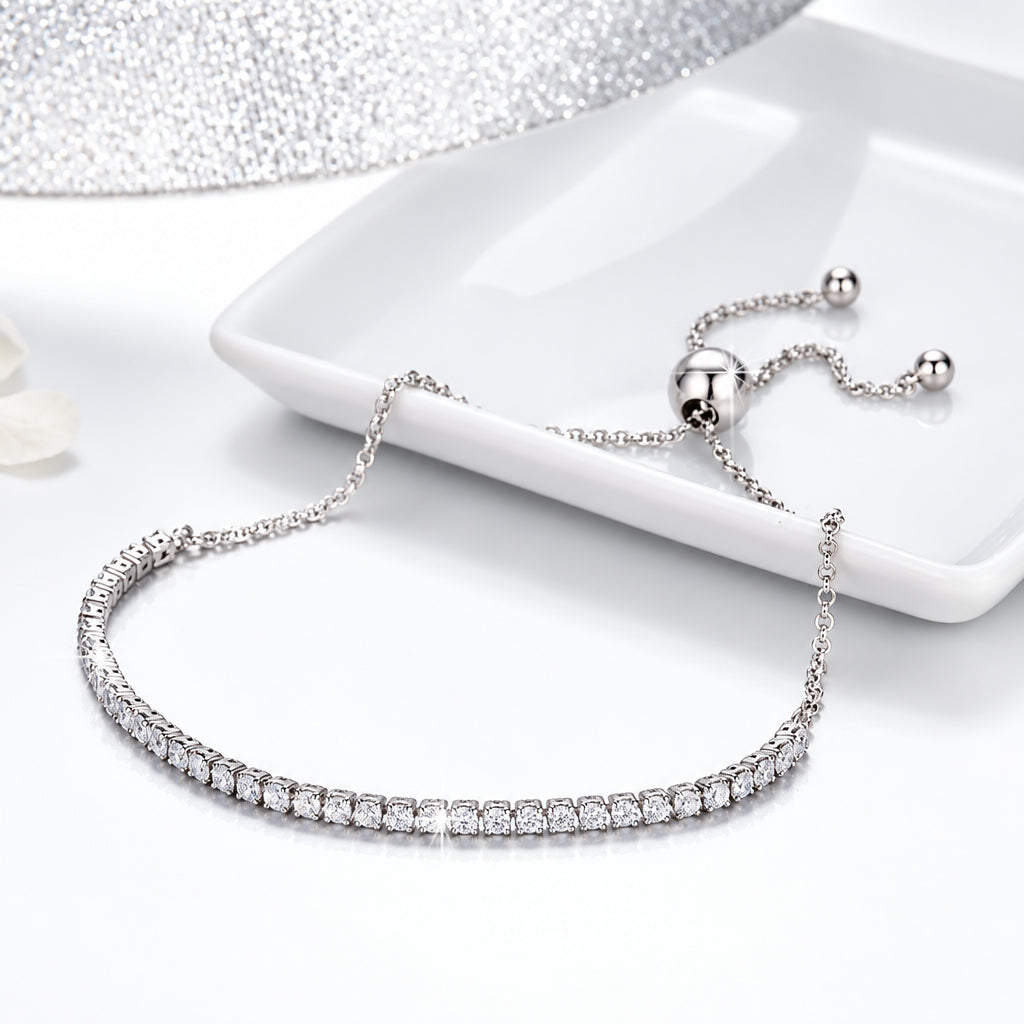 925 sterling silver CZ jewelry bracelet featuring a row of sparkling cubic zirconia stones and an adjustable slider chain in a classic tennis bracelet design.