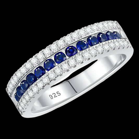 Silver ring with blue gemstones and 'Real Sterling 925' stamp on a white background