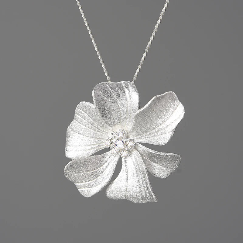Luxury floral jewelry pendant necklace for women with sparkling zircon crystals and 18K gold plated flower design on a 925 sterling silver chain
