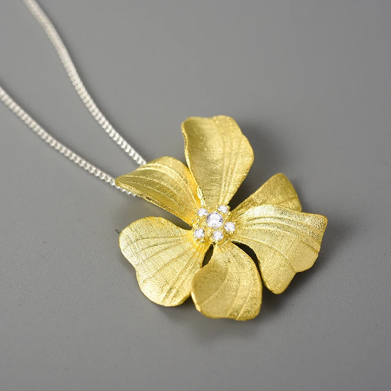 Luxury floral jewelry pendant necklace for women with sparkling zircon crystals and 18K gold plated flower design on a 925 sterling silver chain