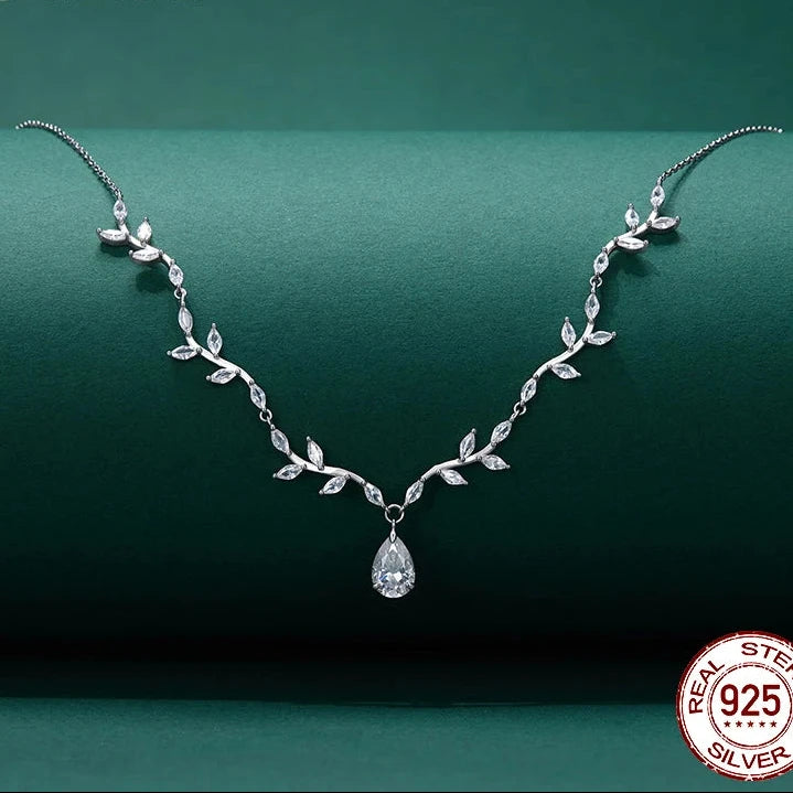 Teardrop moissanite jewelry necklace with D Color VVS1 pear‑cut stone on a 925 silver chain.